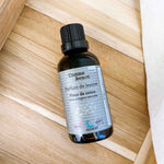 Parfum naturel pour lessive à la fleur de coton, format concentré, présenté en flacon recyclable.