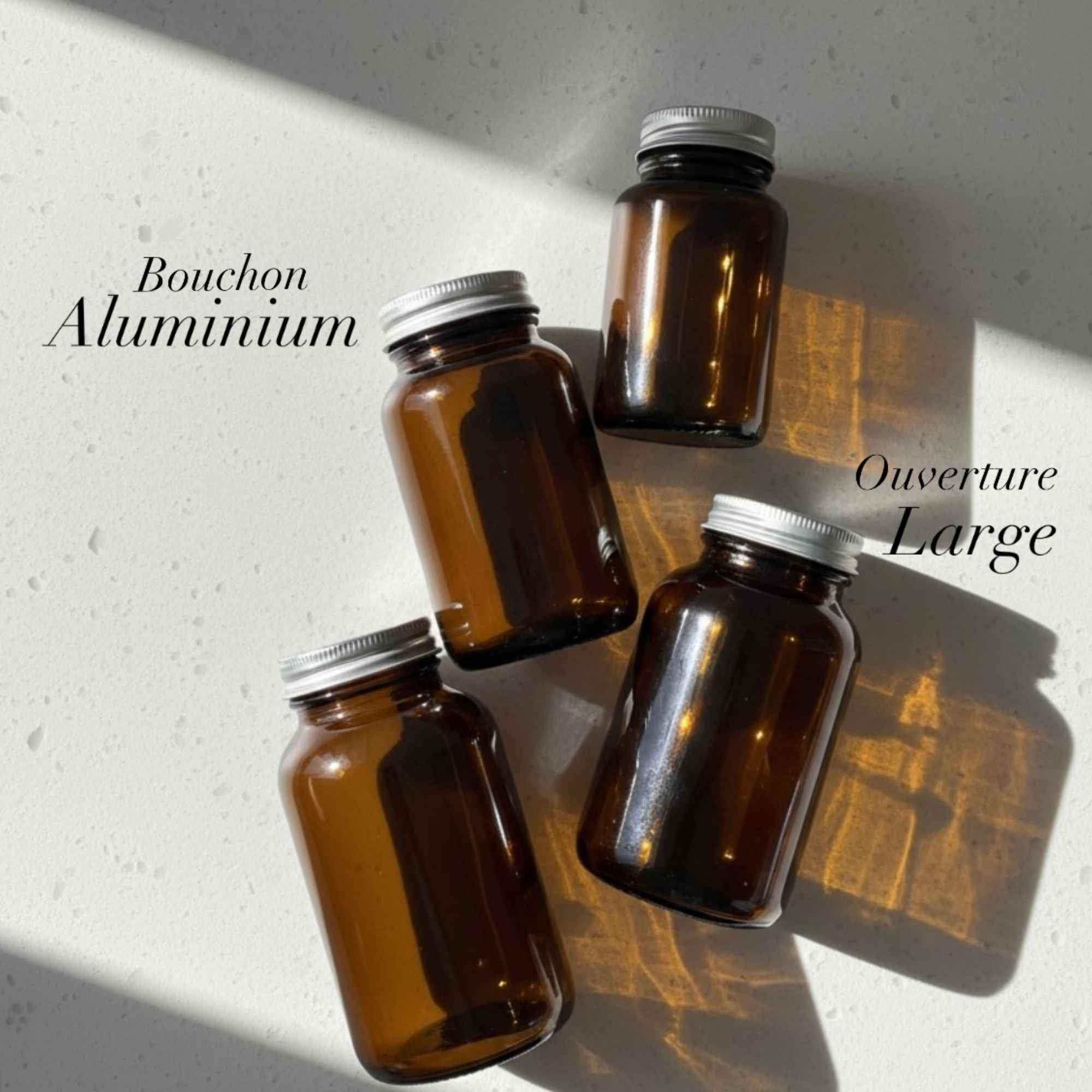 Pot à gélules en verre ambré avec couvercle aluminium gris, idéal pour vos préparations naturelles.